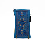 Blue patterned pouch with a decorative design on a white background