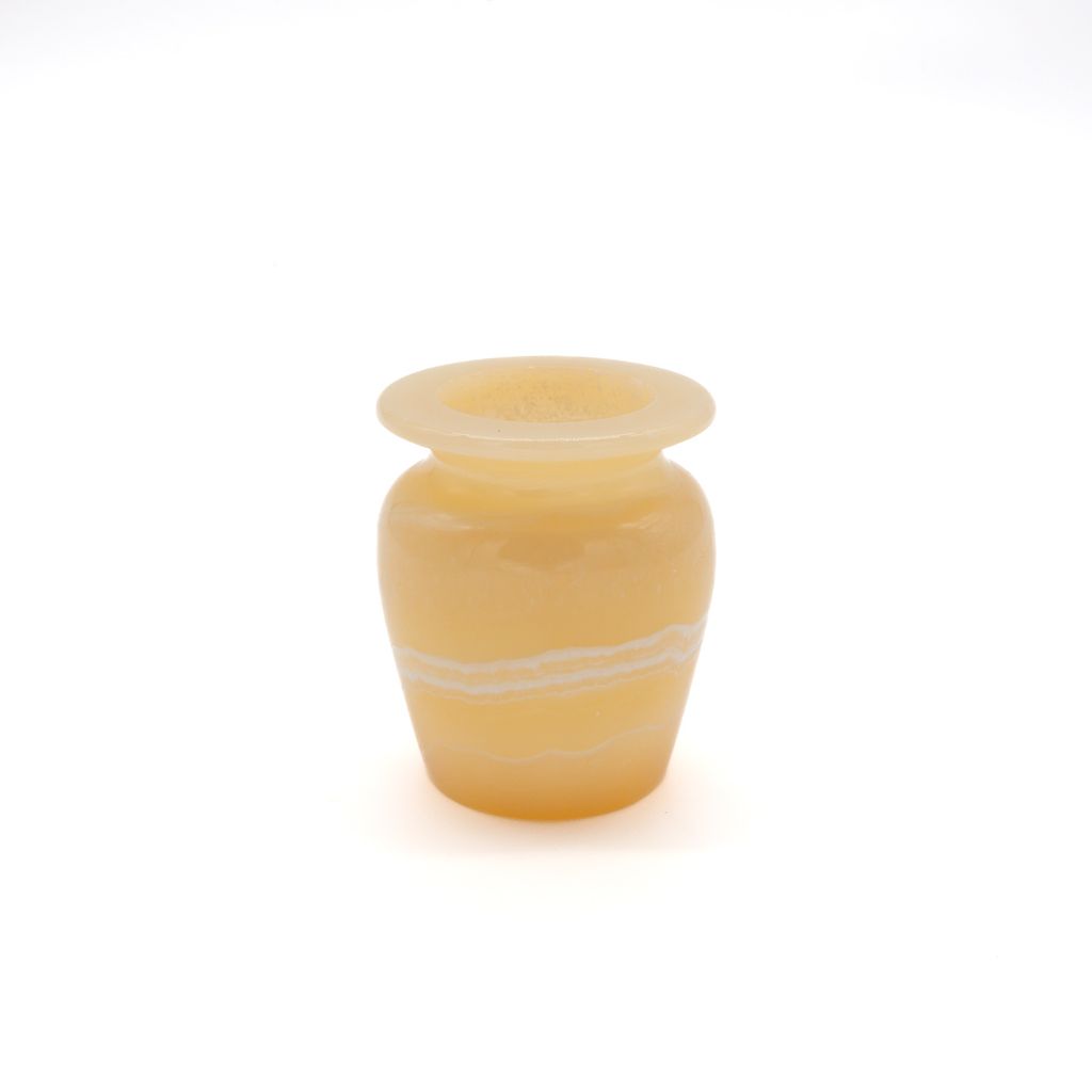 Small tan and white vase on a white background.