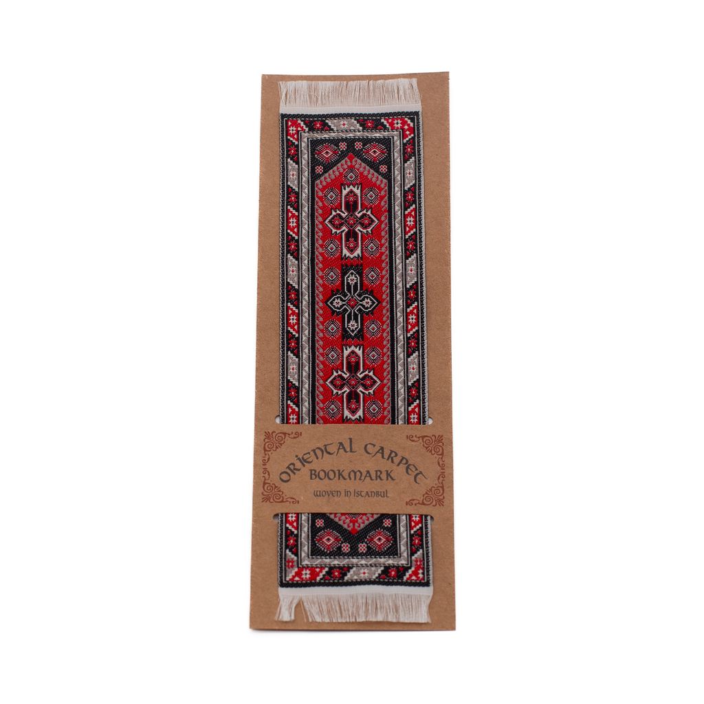 Decorative bookmark with red and tan carpet design on a white background.