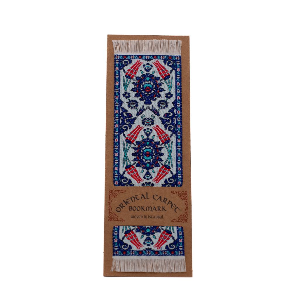 Oriental floral carpet bookmark with decorative pattern on a cardboard backing on a white background.