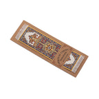 A decorative, yellow rug bookmark with intricate patterns on a white background
