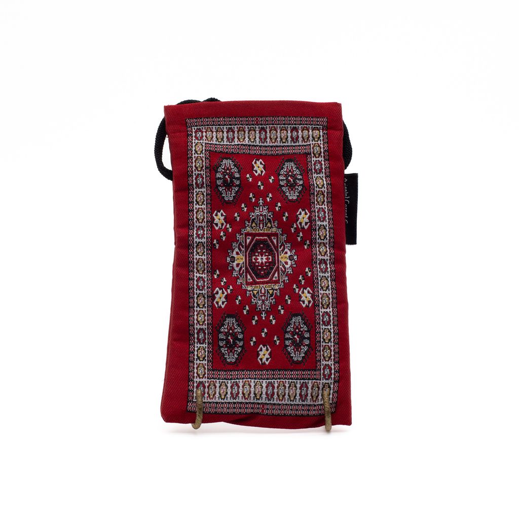 Red patterned bag with a strap on a white background