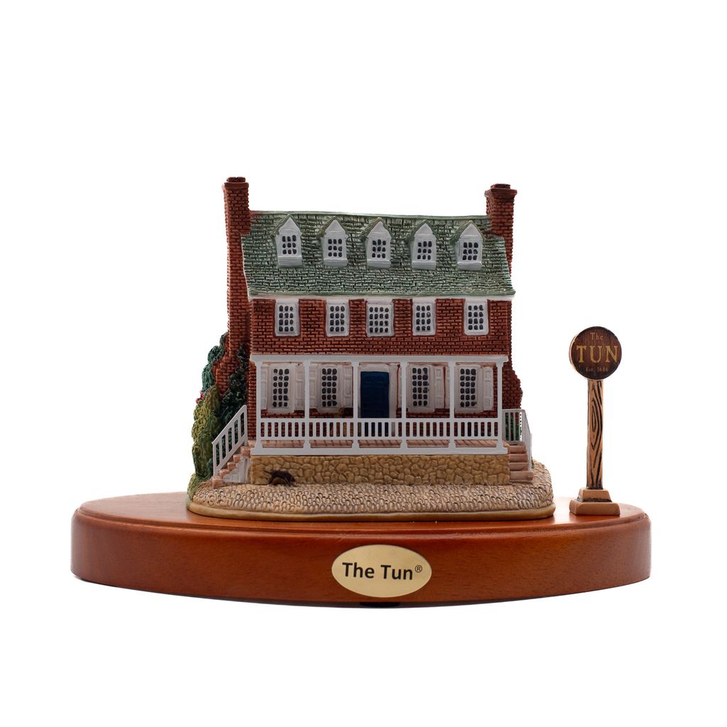Miniature of the Tun Tavern, a brick building with fenced porch and metal tag reading "The Tun."
