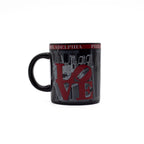Black mug with 'Philadelphia' and city skyline design featuring the iconic red "LOVE" sculpture on a white background.