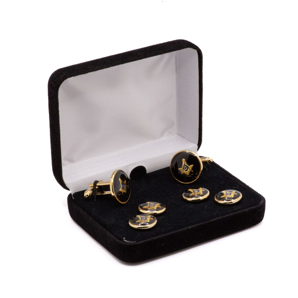 Cufflink set with black and gold Square and Compass design in a black velvet box on a white background.