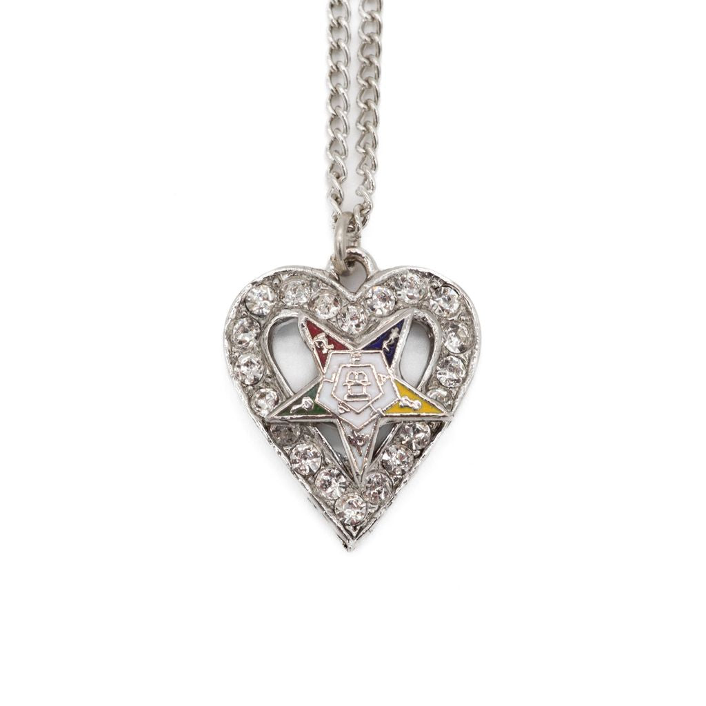 Heart-shaped pendant with Order of the Eastern Star symbols on a chain against a white background