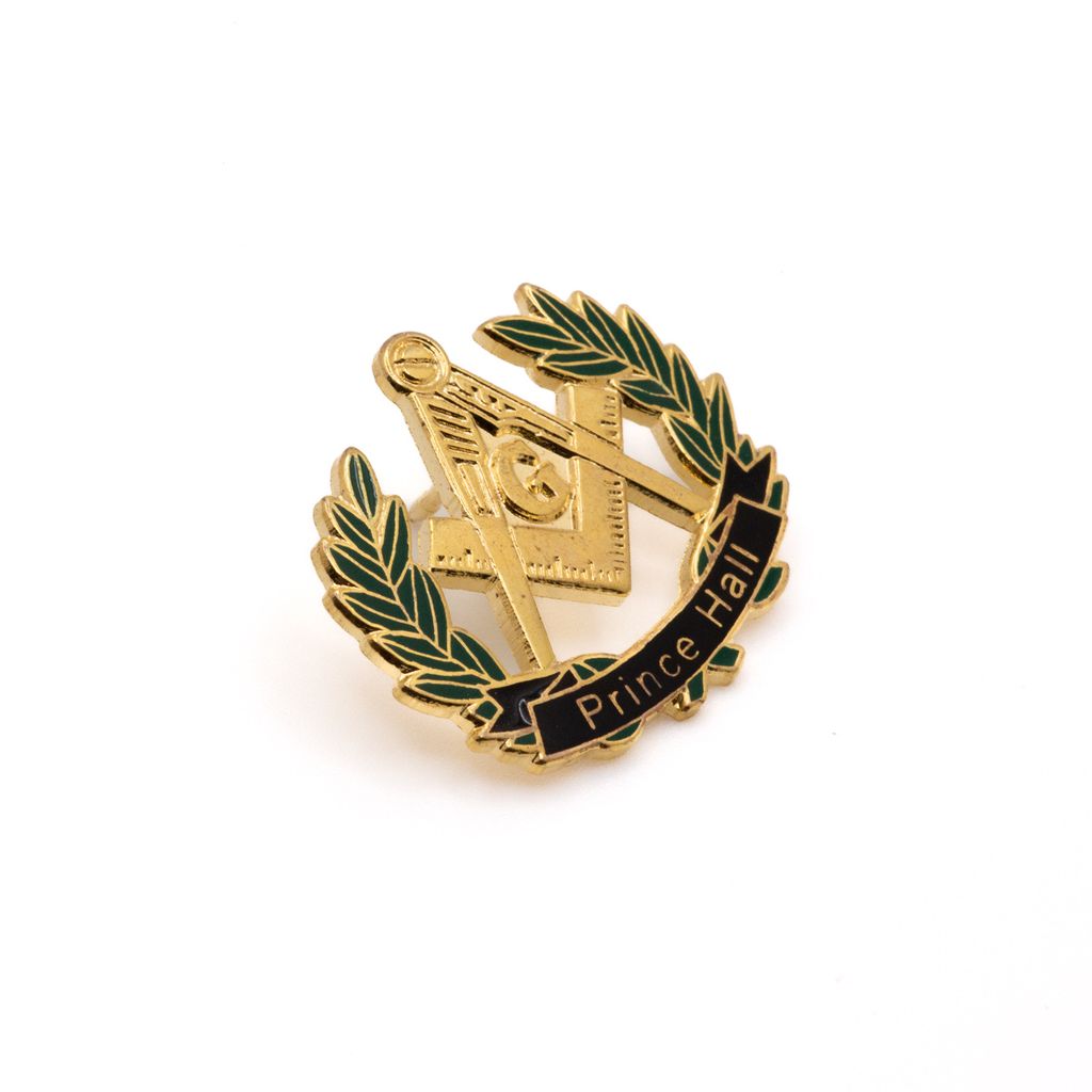 Gold and green lapel pin with Square and Compass and 'Prince Hall' text on a white background