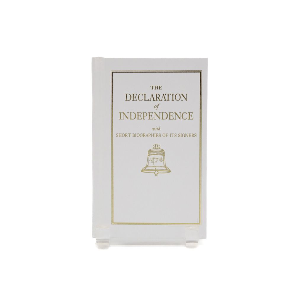 Book titled 'The Declaration of Independence with Short Biographies of its Signers' with a gold bell on a white background