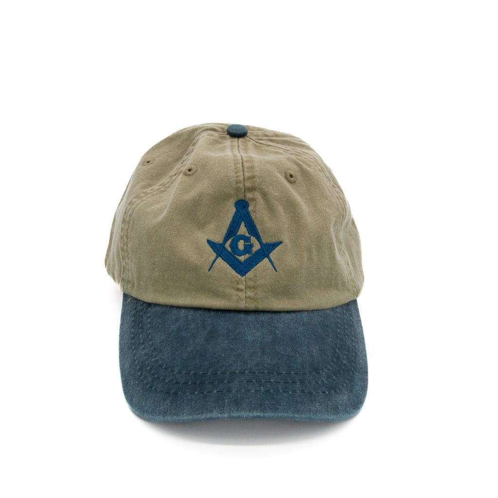 Two-tone blue and green cap with a blue Square and Compass on a white background