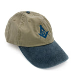 Two-toned green and blue cap with a blue Square and Compass on a white background
