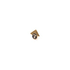 Small gold, white and black pin on a white background