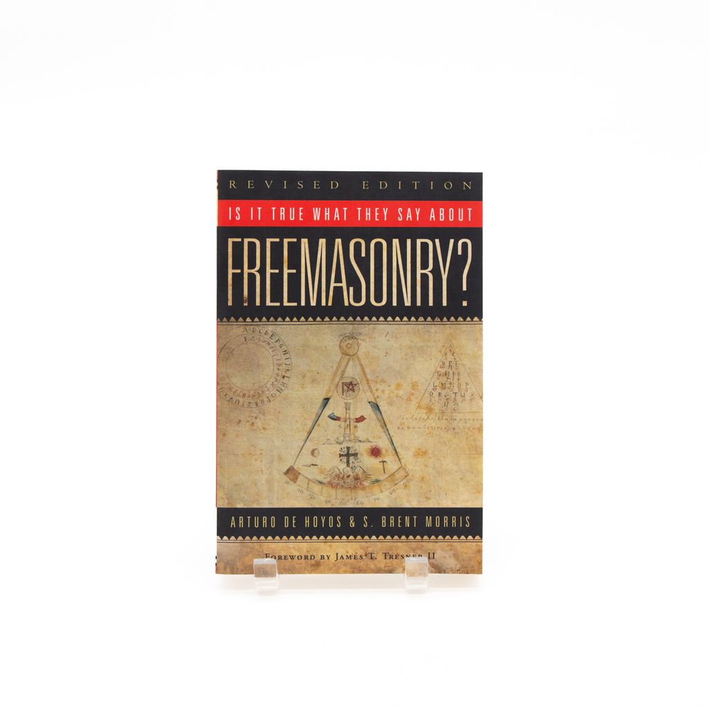 Book cover of 'Is It True What They Say About Freemasonry?' with symbols on a beige background.