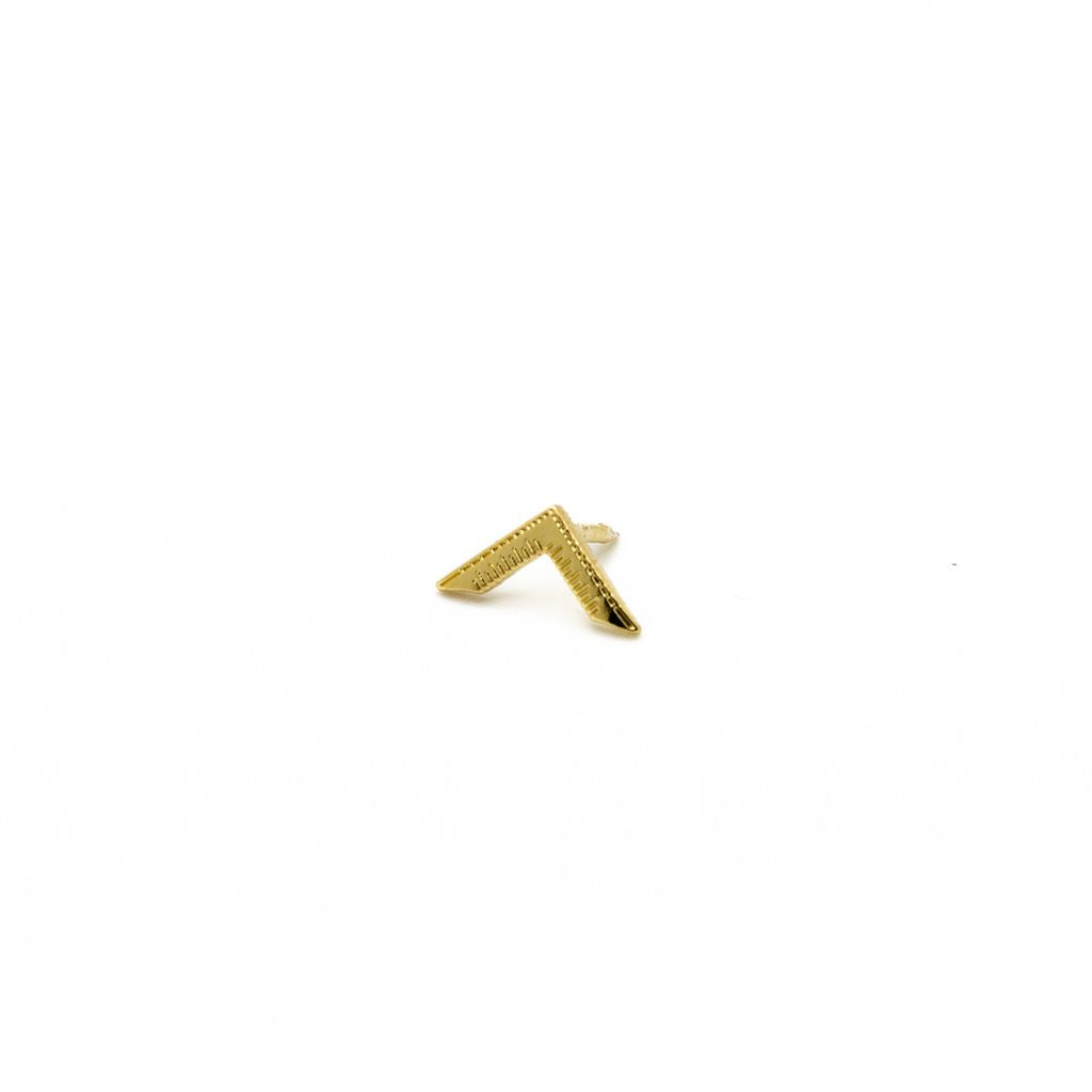 Gold lapel pin with a V-shaped design on a white background