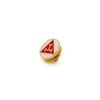 Pin with red and gold triangular design on a white background