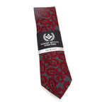 Red and gray patterned necktie with a label on a white background
