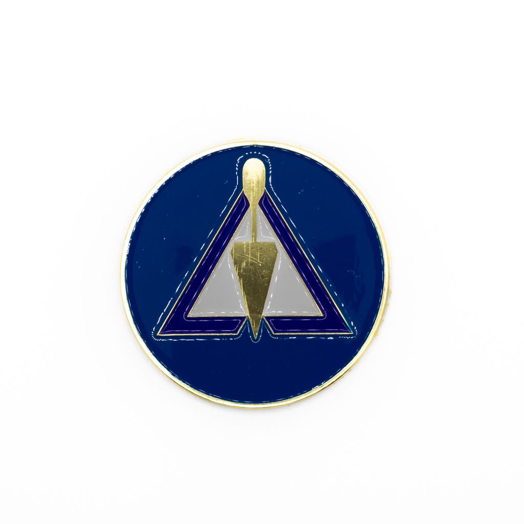 Emblem with a gold triangle design on a blue circular background