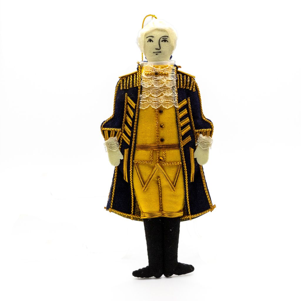 Plush ornament figure of George Washington in a yellow and black coat on a white background
