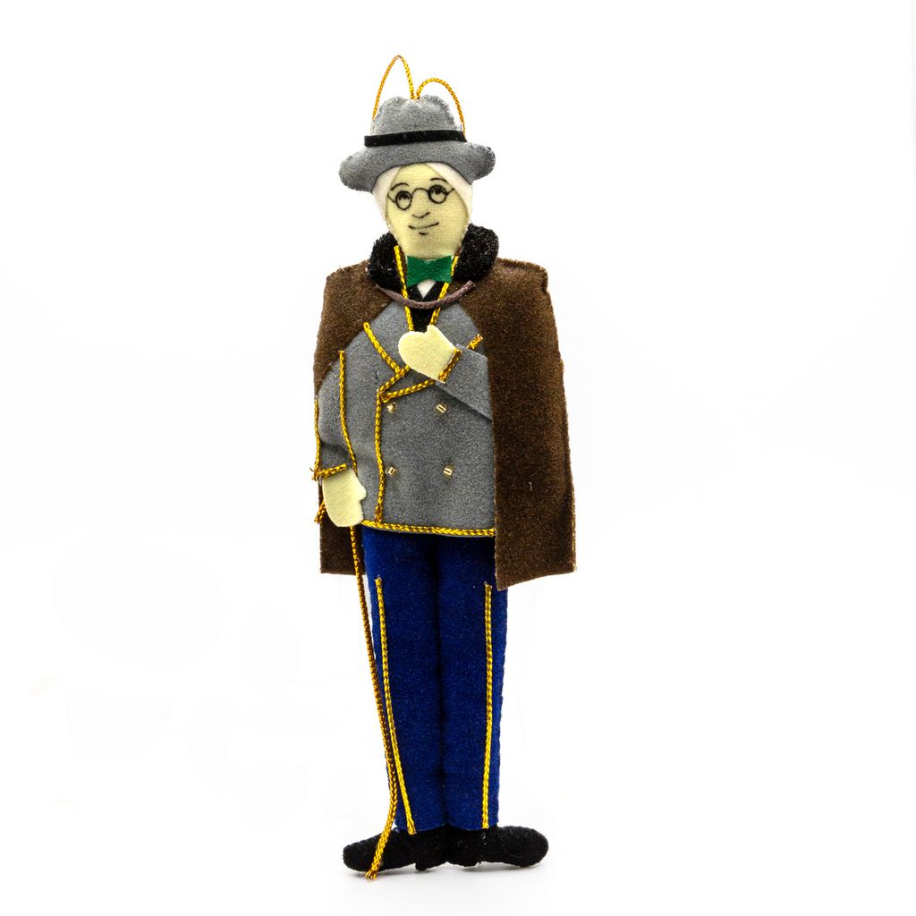 Plush ornament of Franklin D. Roosevelt in a suit and hat on a white background