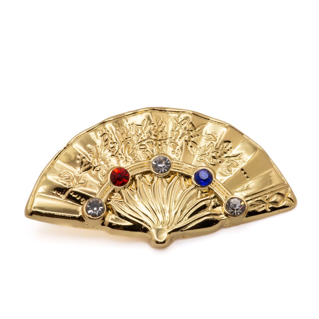 Gold fan-shaped lapel pin with embedded imitation gems on a white background