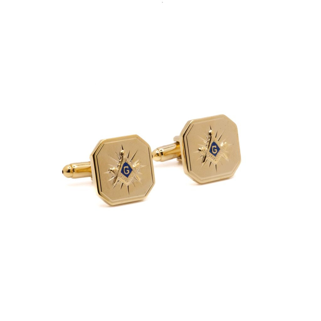 Gold cufflinks with Square and Compass design on a white background