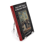 Book titled 'Over 300 Years of Masonic Ritual' on a stand with a white background