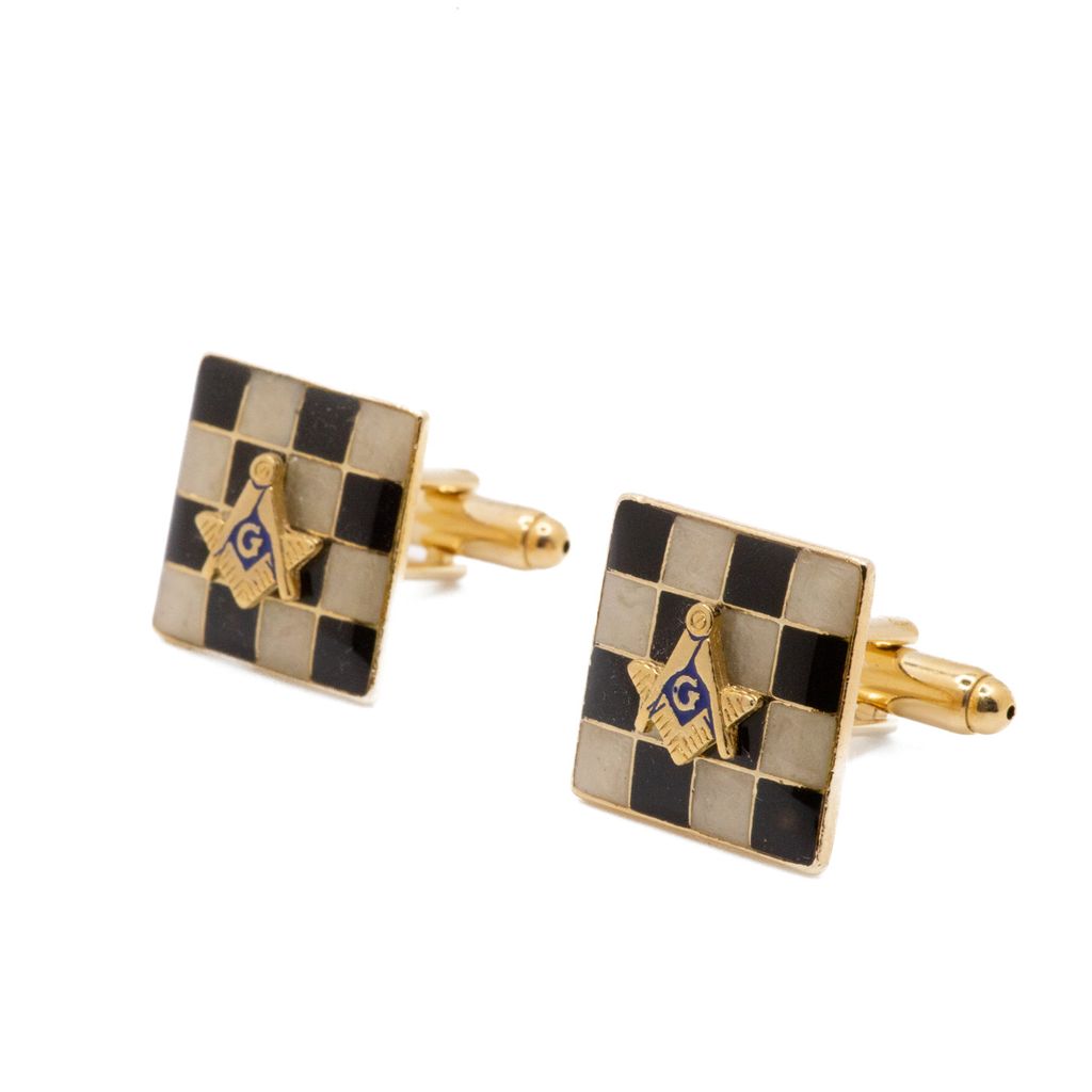Checkered Masonic cufflinks with gold Square and Compass accents on a white background