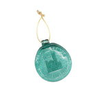 Green round suncatcher with a gold string on a white background