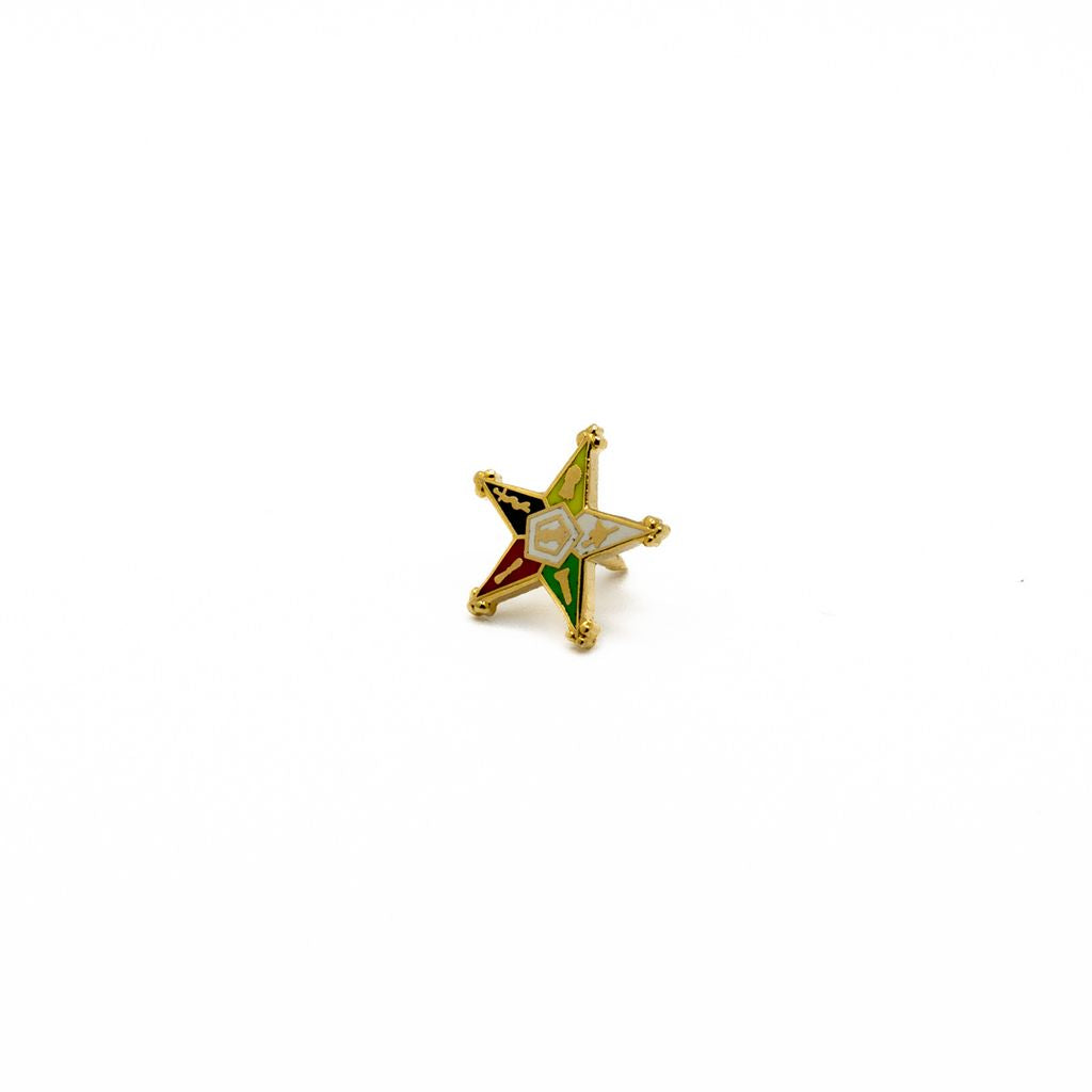 Multi-colored star-shaped pin with gold accents.