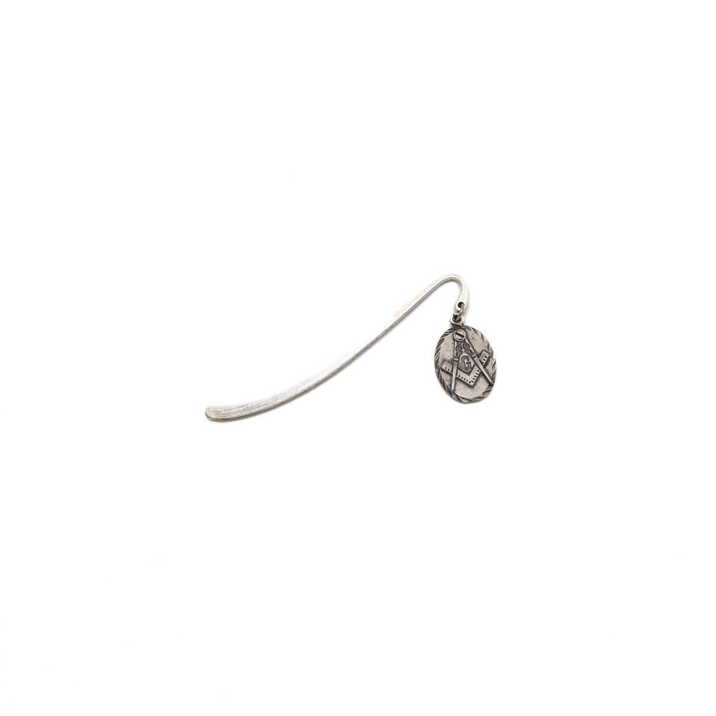 Silver bookmark with decorative end on a white background