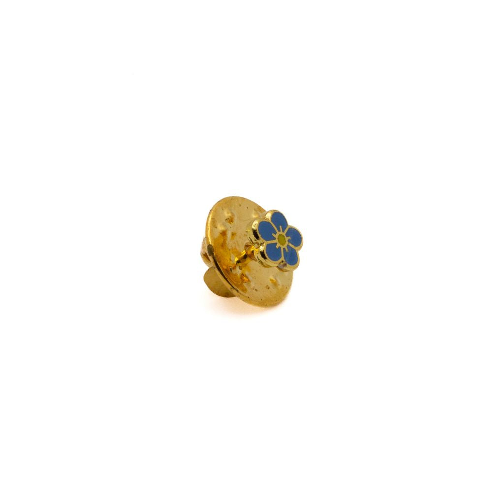 Gold and blue flower-shaped lapel pin on a white background