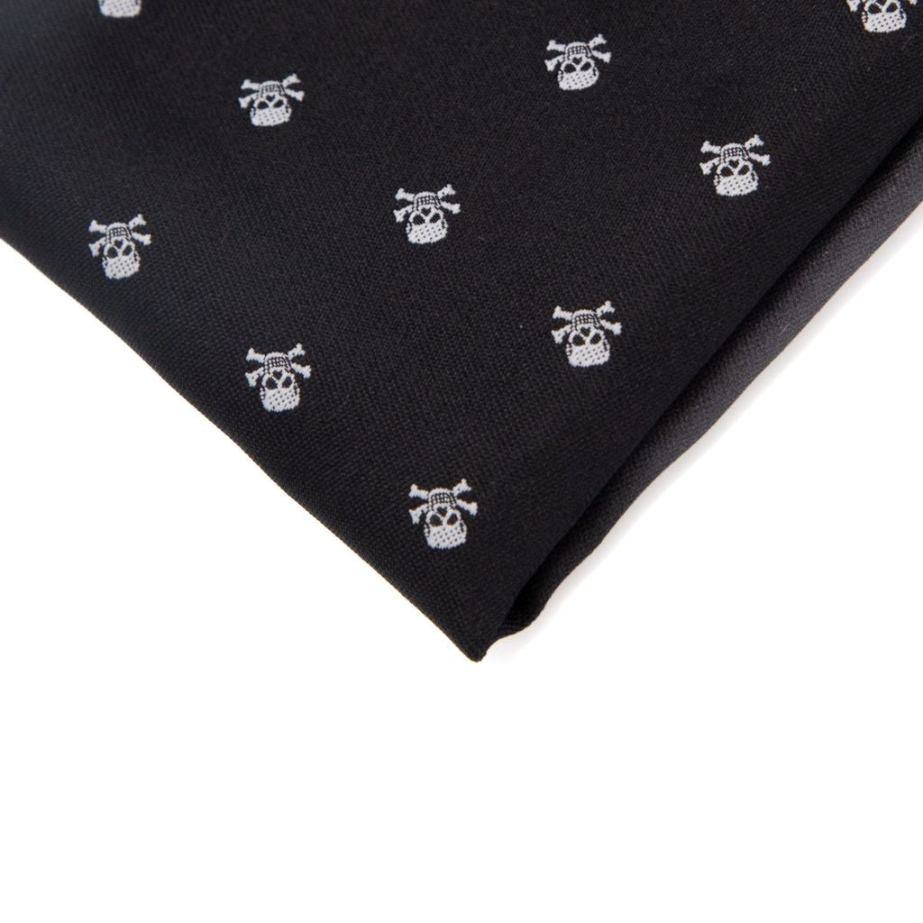 Black fabric with white skull and crossbones pattern