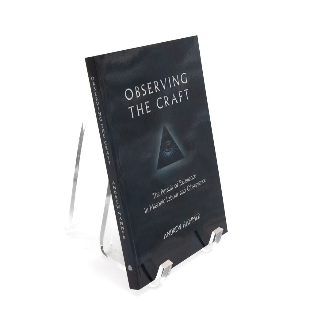 Book titled 'Observing the Craft' on a stand with a white background