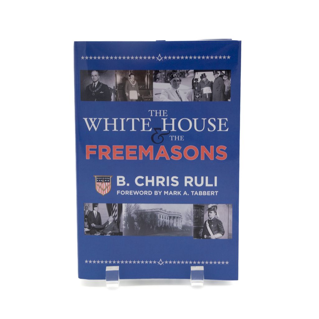 Book titled 'The White House & The Freemasons' by B. Chris Ruli on a white background