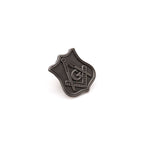Square and Compass on a grey shield-shaped lapel pin with a white background