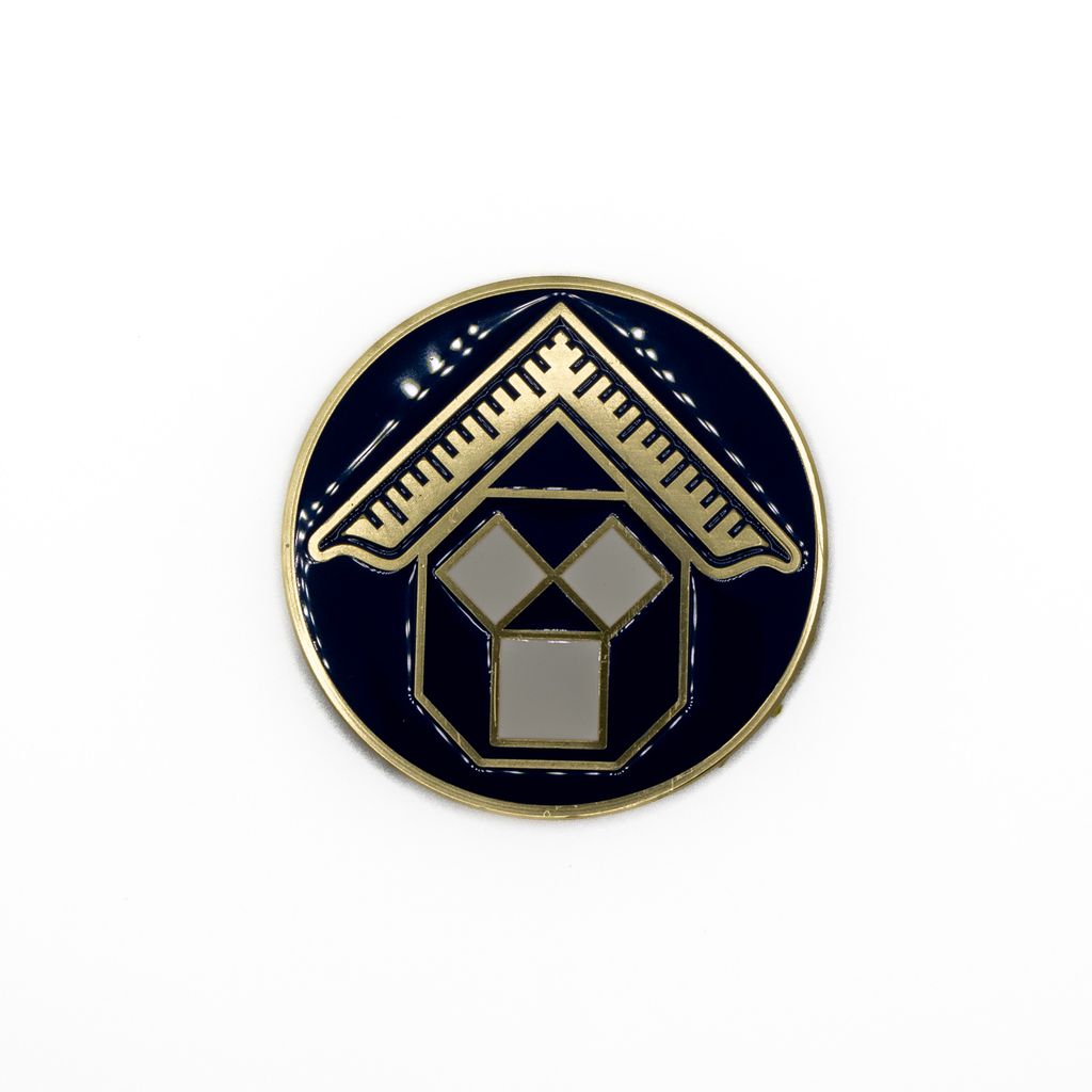 Pin with geometric design on a white background