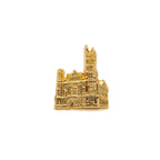 Gold-colored pin cutout of Masonic Temple, Library and Museum on a white background