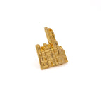 Gold-colored pin cutout of Masonic Temple, Library and Museum on a white background