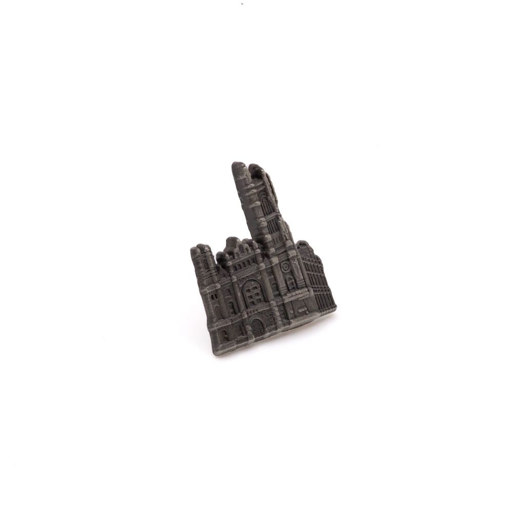 Silver-colored pin of 3-D cutout of the Masonic Temple, Library & Museum building on a white background.