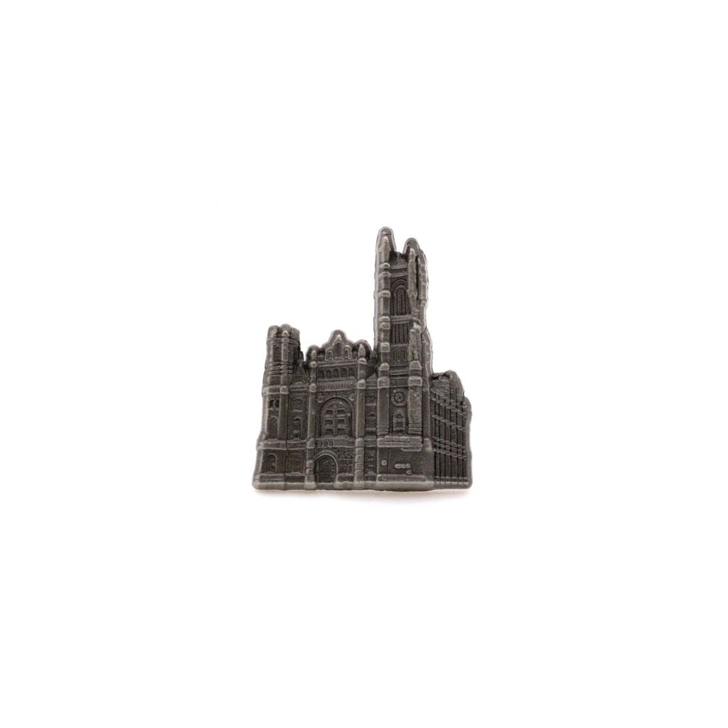 Silver-colored pin of 3-D cutout of the Masonic Temple, Library & Museum building on a white background.